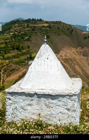 A small temple on a hilltop. These small dome temples are typical in the Himalayan region of Uttarakhand. Stock Photo