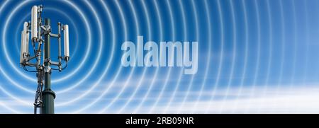 Closeup of a telecommunications tower with antennas (aerial) and radio waves, against a clear blue sky with clouds and copy space. Stock Photo