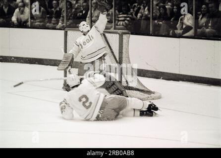 California Golden Seals goalie Gilles Meloche (27)blocking without a ...