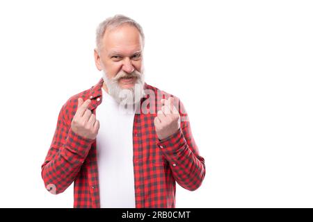 mature gray-haired man with a beard crossed his fingers Stock Photo