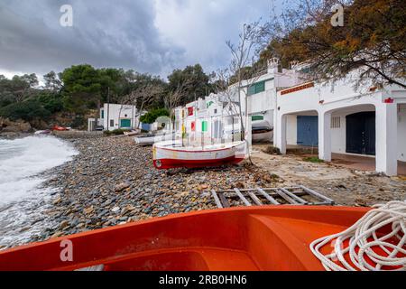 Fishermen's shacks in Cala S'Alguer on the coast of the Costa Brava in the province of Girona in Spain Stock Photo