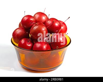 Cherry plums, Prunus cerasifera, in a glass bowl Stock Photo