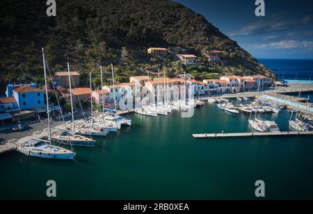 Sailboats in Capraia town harbor, Capraia island, Tuscany, Italy, Stock Photo