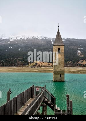 Tower of the old parish church of St. Catherine in the Reschensee, Graun in the Vinschgau Valley. Stock Photo