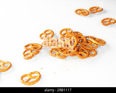 Stack of cumin pretzels on white background. Stock Photo