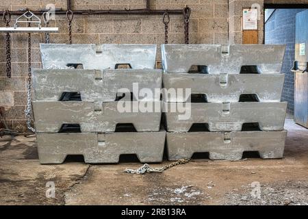 A stack of large zinc ingots in a hot dip galvanising plant. Steel items are dipped into a bath of molten zinc in order to prevent corrosion (UK) Stock Photo