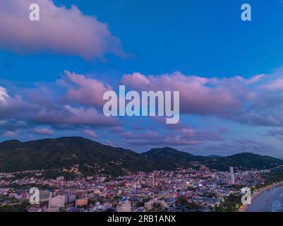 Aerial view of a building in Patong city at twilight. scene romantic pink sky on sunset at Patong beach. abstract nature background. Sunset with brigh Stock Photo