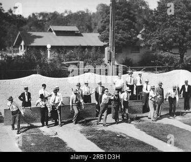 Los Angeles, California:  c.  1928 Horseshoe pitching experts at the Horseshoe, Chess and Checker Club in Exposition Park preparing for the championships to be held at the LA County Fair. Stock Photo