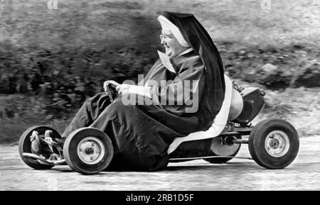 Akron, Ohio: October 10. 1962. Sister John Bosco of the St. Sebastian School  in Akron having fun tooling around a go-kart track. Stock Photo
