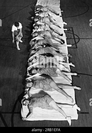 Chicago, Illinois,  December 23, 1929 Miss Alice Waterman giving a Mary Garden reducing exercise lesson to members of the Illinois Womens Athletic Club. Stock Photo