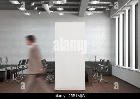 Blank roll up banner stand in white brick office interior Stock Photo