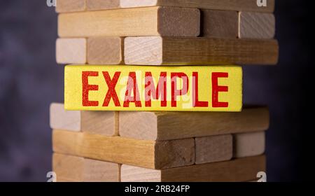 Example, text words typography written with wooden letter, life and business motivational inspirational concept. Stock Photo