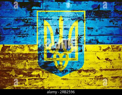 Coat of Arms of Ukraine painted on brick wall Stock Photo