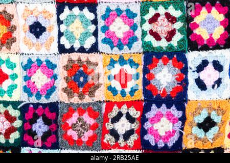 Multi colored blanket in wool, geometric background, retro decorative pattern Stock Photo