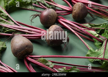 Fresh beetroots with leaves on green background Stock Photo