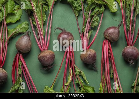 Fresh beetroots with leaves on green background Stock Photo