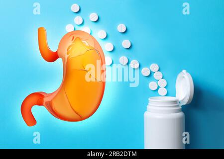 Heartburn treatment. Antacid pills and illustration of unhealthy stomach on light blue background, flat lay Stock Photo