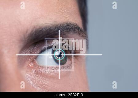 Vision test. Laser reticle focused on man's eye, closeup Stock Photo
