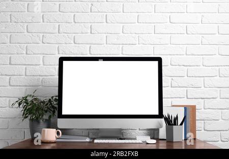 Cozy workspace with modern computer on wooden desk Stock Photo