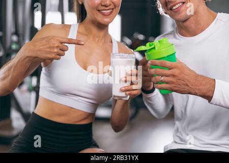 sport healthy people show compare milk and whey protein shake are good beverage food meal for gain mass body muscle bodybuilding Stock Photo