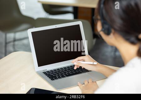 people working on laptop with blank copy space screen for advertising text image overlay in office desk, Back view of business woman hands busy using Stock Photo