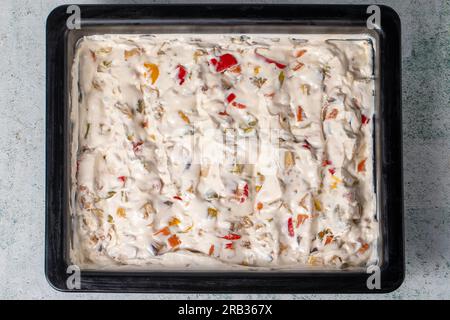 Salad with potatoes and yogurt on gray background. Salad with yogurt, potatoes and garlic. healthy appetizers. Local name panco Stock Photo