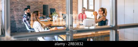 Colleagues searching ideas in brainstorm while having fun playing with basket ball Stock Photo