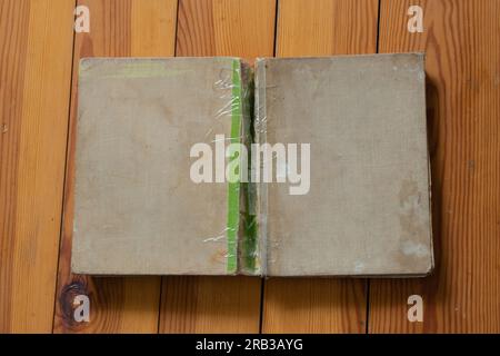 books lie on a wooden table top view down Stock Photo