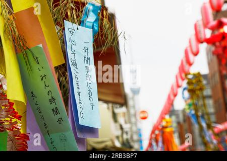July 7, 2023, Tokyo, Japan: Colorful papers (Tanzaku) with the wishes of people to celebrate the Tanabata festival decorate Kappabashidogugai Street, the shopping street near Asakusa in Tokyo. Kappabashi-dori, also known just as Kappabashi or Kitchen Town, is a shopping street in Tokyo between Ueno and Asakusa famous for supplying the restaurant industry. The annual celebration commemorates the legend of two lovers separated by the Milky Way who only meet once a year on the seventh day of the seventh month. (Credit Image: © Rodrigo Reyes Marin/ZUMA Press Wire) EDITORIAL USAGE ONLY! Not for Com Stock Photo