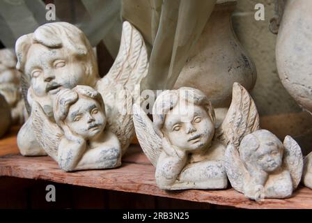 Small decorative angel figurines in old fashioned style. Stock Photo