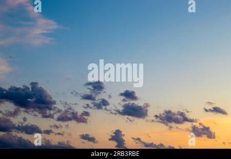 Real Amazing Panoramic Sunrise or Sunset Sky with Gentle Colorful Clouds. Long Panorama. Stock Photo