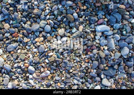 Beach Pebbles. Small Sea Stones, Gravel. Background. Textures. Stock Photo