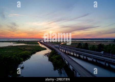 Mobile Bay and jubilee parkway bridge at sunset Stock Photo