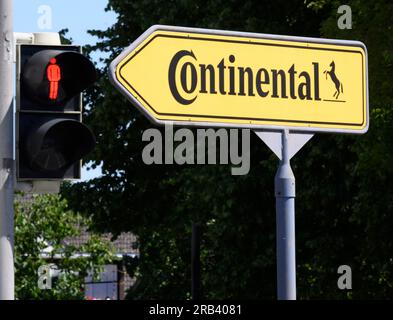 Gifhorn, Germany. 07th July, 2023. A red traffic light shines next to a sign pointing the way to the Continental plant. The automotive supplier Continental wants to close its loss-making plant in Gifhorn by the end of 2027. Credit: Julian Stratenschulte/dpa/Alamy Live News Stock Photo