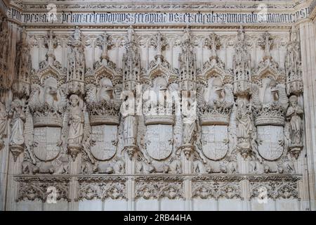Toledo, Spain - Mar 27, 2019: Wall with Catholic Kings Coat of Arms at Church Interior in Monastery of San Juan de los Reyes - Toledo, Spain Stock Photo