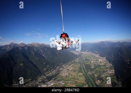 Switzerland, Canton Ticino, parachuting Stock Photo