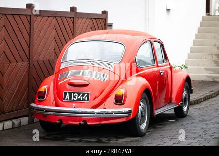 AKUREYRI, ICELAND - JULY 5, 2014: Volkswagen Beetle 1300 legendary car with bright red colour in Iceland Stock Photo