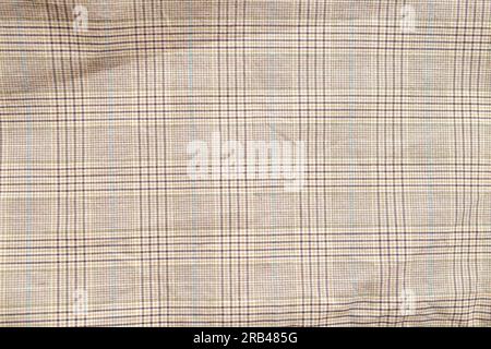 Checkered pattern on beige fabric, close up of textile texture for element design Stock Photo