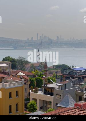 View from Seven Hills Restaurant across rooftops of Istanbul towards the Bosporus Sea and the Asian side of the city. Turkey Stock Photo