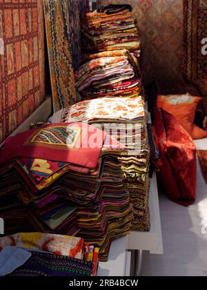 Carpet samples in piles in a shop in Istanbul, Turkey Stock Photo