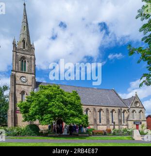 A wedding party leave the church St Paul’s Church, Ramsbottom. Stock Photo
