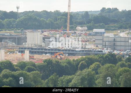 West Hyde, Hertfordshire, UK. 7th July, 2023. The HS2 South Portal High Speed Rail Site at West Hyde in Hertfordshire. The site includes a Viaduct Precast Factory where HS2 make the viaducts for railway on site. The former fields are unrecognisable now and the site covers a vast area. The building of the HS2 station at Euston has been put on hold by the Government. Many people believe that the HS2 project should be stopped completely and the money spent on the NHS and cost of living crisis instead. Credit: Maureen McLean/Alamy Live News Stock Photo