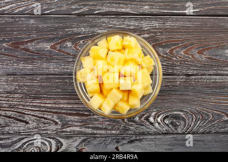 sliced pineapple on wood background Stock Photo