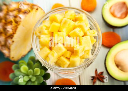 sliced pineapple on wood background Stock Photo