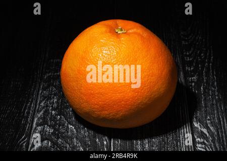 one grapefruit on wood background Stock Photo