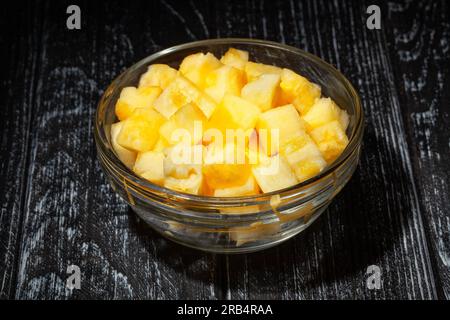 sliced pineapple on wood background Stock Photo