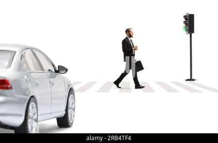 Car waiting at pedestrian and a businessman walking with a briefcase and a takeaway coffee isolated on white background Stock Photo