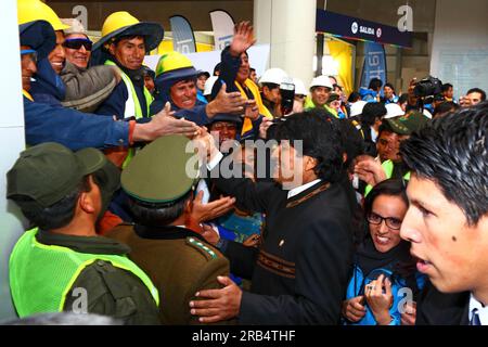 El Alto, Bolivia, 15th September 2014. Bolivian president Evo Morales (centre) greets Mi Teleferico company workers as he arrives at the station in Ciudad Satelite for the opening ceremony of the Yellow Line. The Yellow Line is the second of three cable car lines to be opened this year, and is part of an ambitious project to relieve traffic congestion. The first line opened in May, when all three are open they will be the world's longest urban cable car system. The system has been built by the Austrian company Doppelmayr. Stock Photo