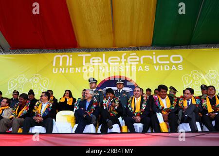 El Alto, Bolivia, 15th September 2014. Bolivian president Evo Morales (centre) and vice president Alvaro Garcia Linera (left centre) at the station in Ciudad Satelite during the inauguration ceremony of the Yellow Line. The Yellow Line is the second of three cable car lines to be opened this year, and is part of an ambitious project to relieve traffic congestion. The first line opened in May, when all three are open they will be the world's longest urban cable car system. The system has been built by the Austrian company Doppelmayr. Stock Photo