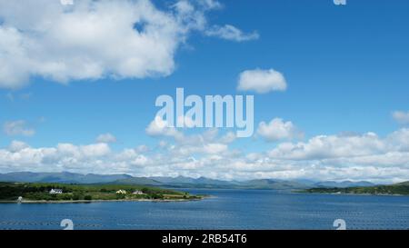 View from the Beara Peninsula across Kenmare Bay towards the mountains of County Kerry. Please note the large mussel farm in the foreground Stock Photo